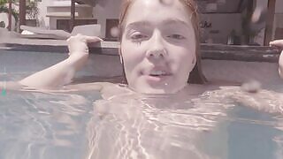 Sweet redhead Jia Lissa enjoys swimming as she presents her milky body while underwater